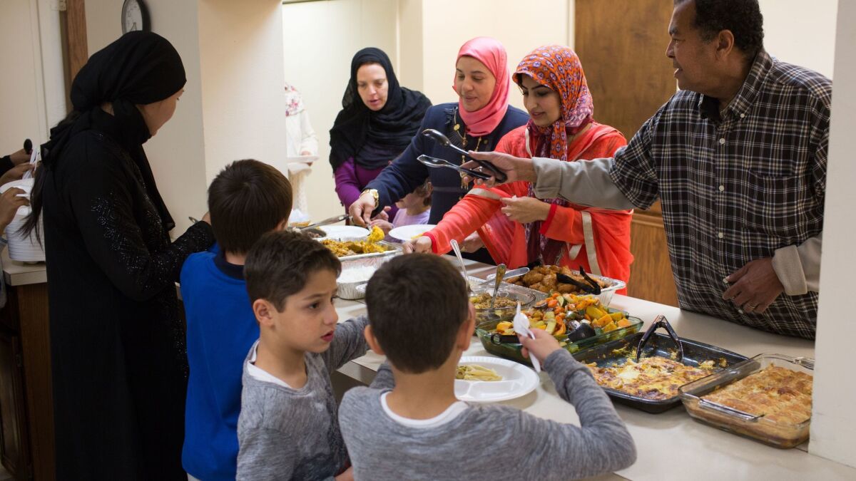 Food is served during a potluck and discussion at the Islamic Center of Cedar Rapids on Nov. 12, 2016.