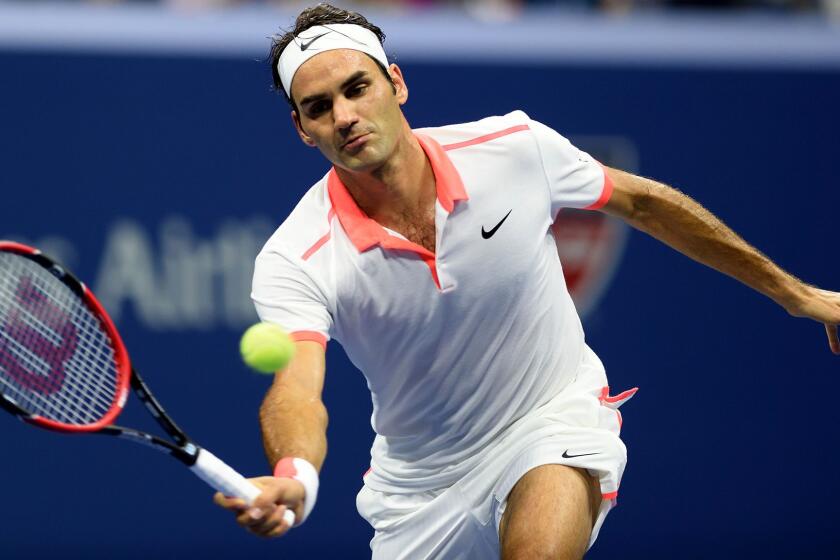 Roger Federer prepares to volley a shot during his victory over Richard Gasquet at the U.S. Open on Wednesday night.