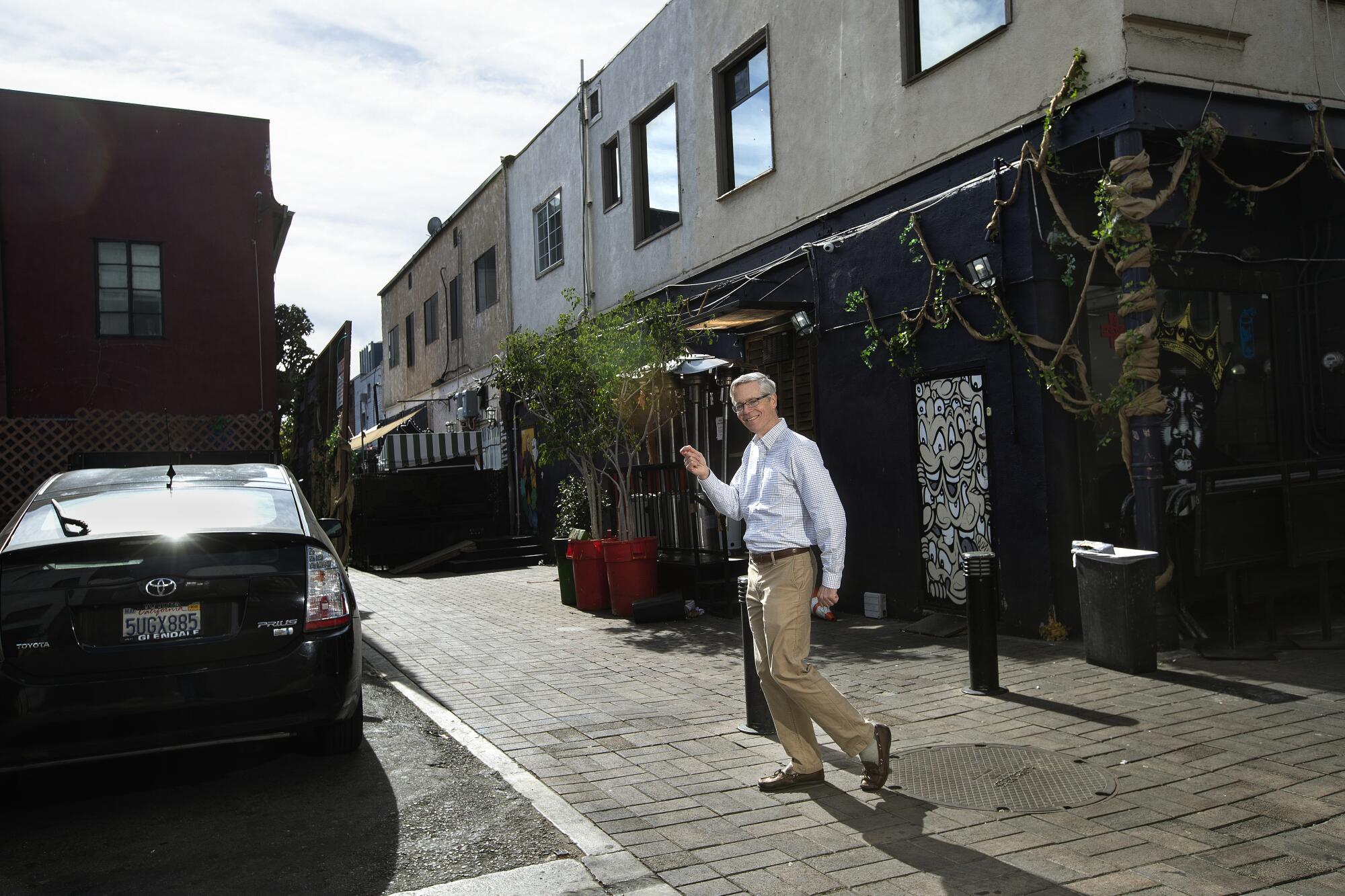 John Bengtson poses in a urban alleyway