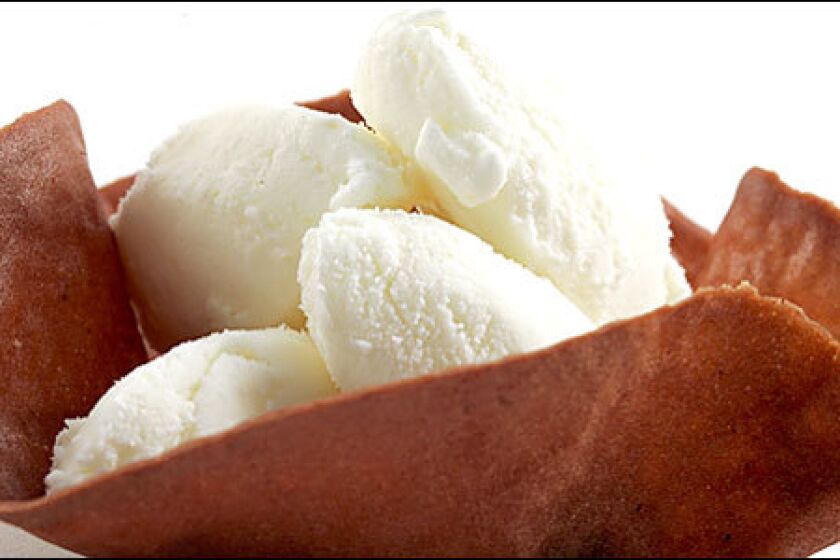 EAT THE WHOLE THING: Tart lemon frozen yogurt in an edible bowl.