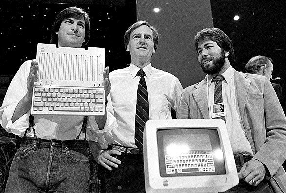 Jobs, left, unveils the Apple IIc computer with Apple Chief Executive John Sculley and co-founder Steve Wozniak. Jobs and Wozniak met when Jobs was in high school in Cupertino, Calif., and Wozniak was intermittently attending college. The two partnered up to make and sell machines that let users make free international phone calls. In 1976, they founded Apple in a Los Altos, Calif., garage.