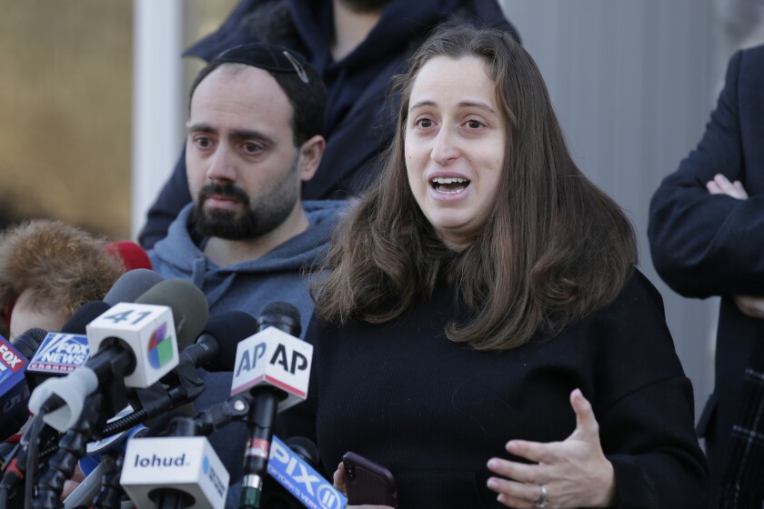 Nicky Cohen, whose father Josef Neumann was critically injured when a man attacked a Hanukkah celebration with a machete, speaks to reporters in front of her home in New City, N.Y., on Thursday.