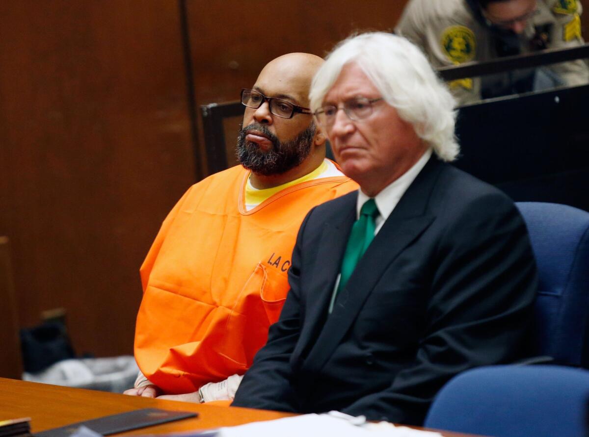 Marion "Suge" Knight, left, appears with his attorney, Thomas A. Mesereau Jr., during a court hearing in his murder case.