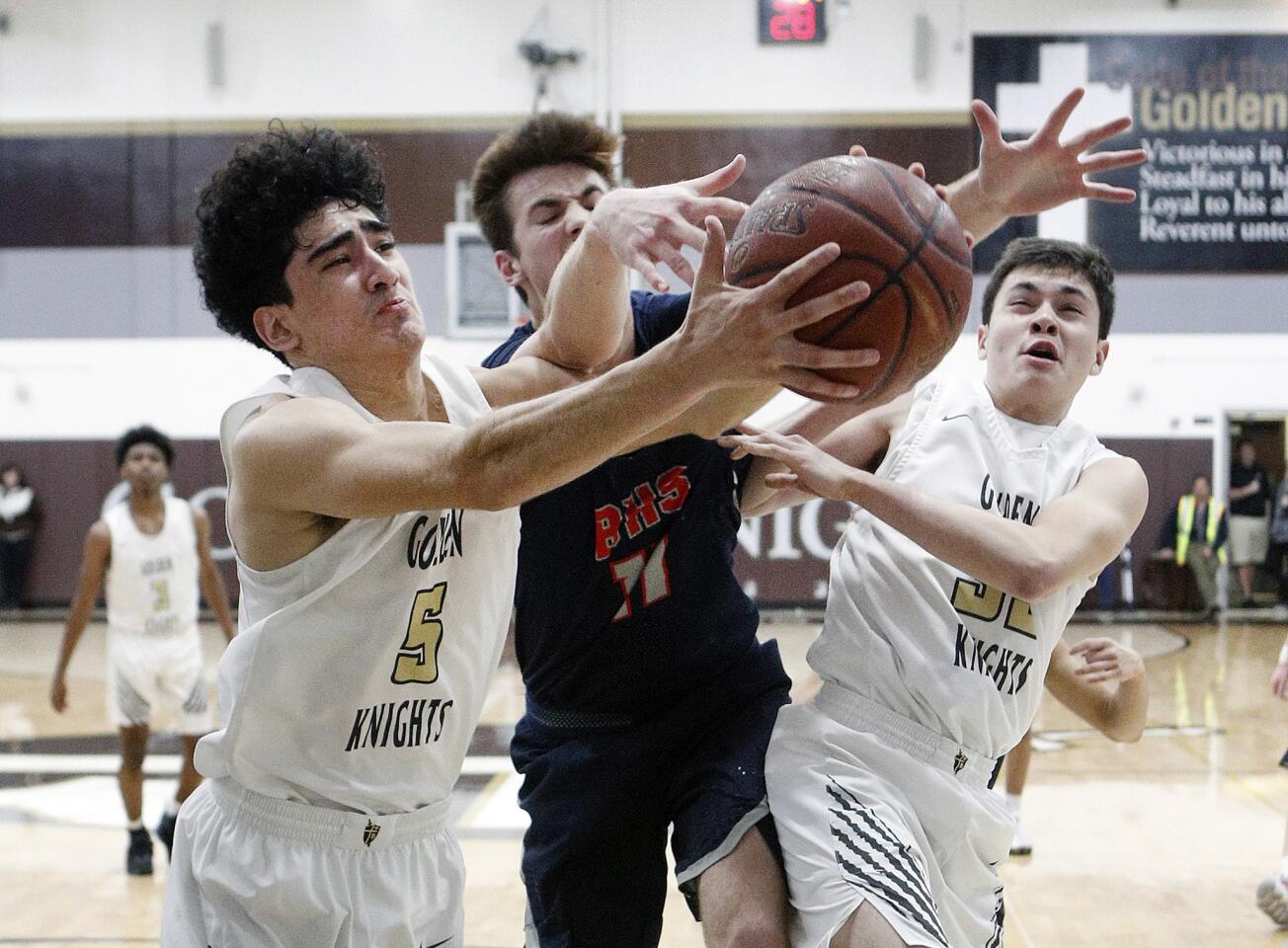 St. Francis' Matthew Molina and Beckman's Dylan Thoerner battle for a rebound in a CIF Southern Section Division III-AA second-round boys' basketball game at St. Francis High School on Tuesday, February 12, 2019.