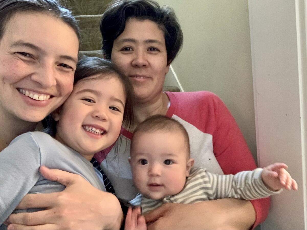 Rebecca Albers and Maiya Papach, with children Lillian and Naoki