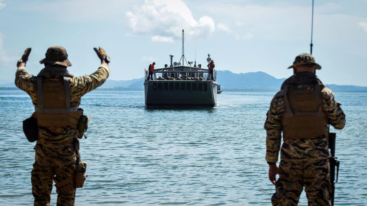 Philippine special forces guide an amphibious landing craft on a beach on May 15, 2017, in Casiguran province during exercises with U.S. troops.