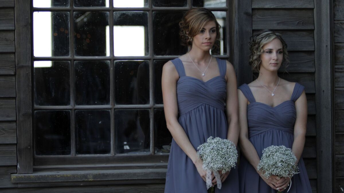 Bridesmaids pose for wedding photographs in Stevinson, Calif., in 2013.