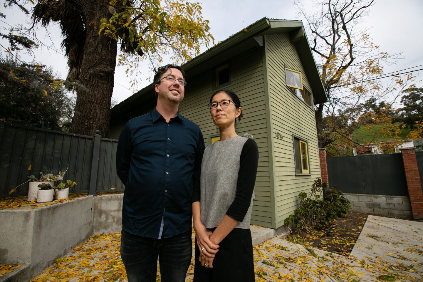 Los Angeles, CA., December 10, 2019: Bo Sundius, 44, and Hisako Ichiki, 44, owners of Bunch Design, a L.A. based husband and wife design firm stand for a portrait outside of one of their Accessory Dwelling Units (ADUs) on Tuesday, December 10, 2019. Bunch Design focuses on both custom and pre-designed ADU’s. (Jason Armond / Los Angeles Times)