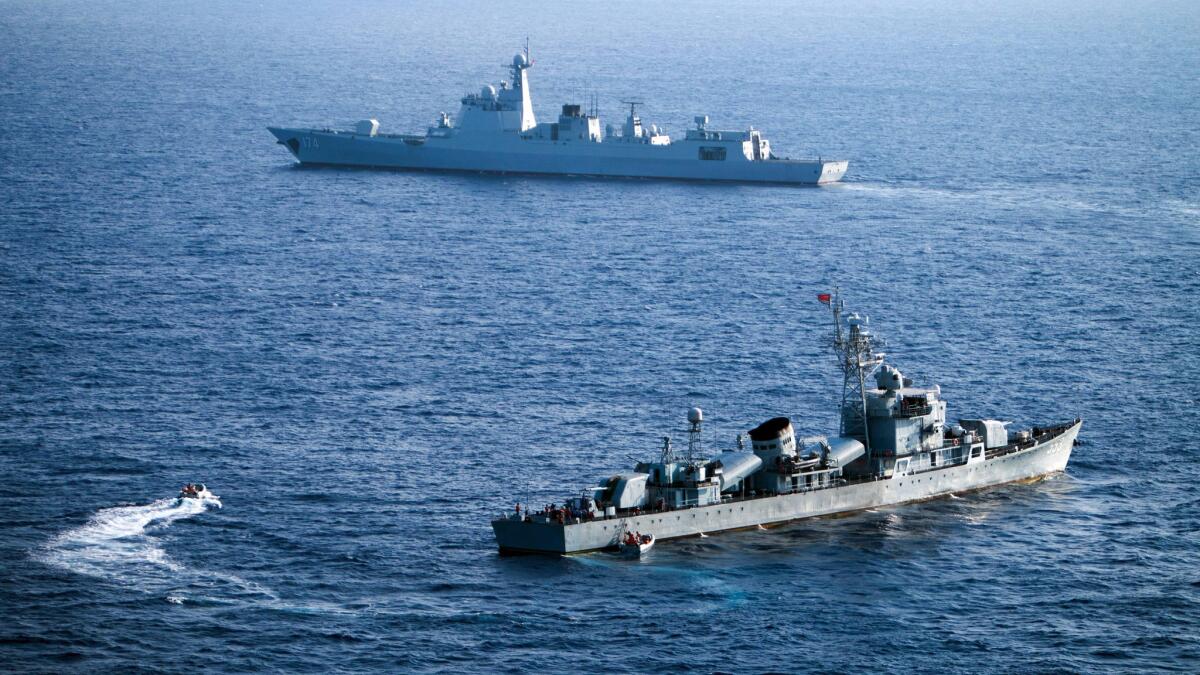 Crew members of China's South Sea Fleet take part in a drill off the Xisha Islands in May.