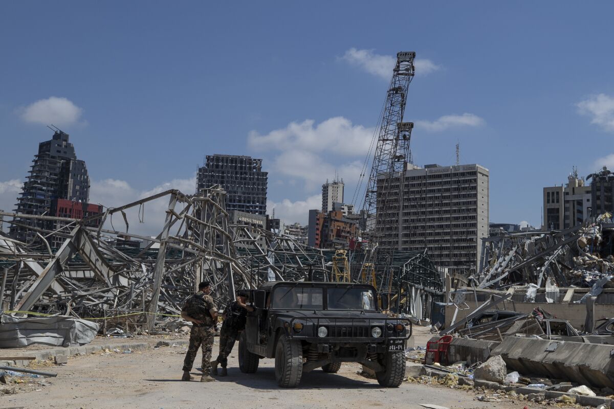 Lebanese soldiers stand guard at the site of the Beirut blast