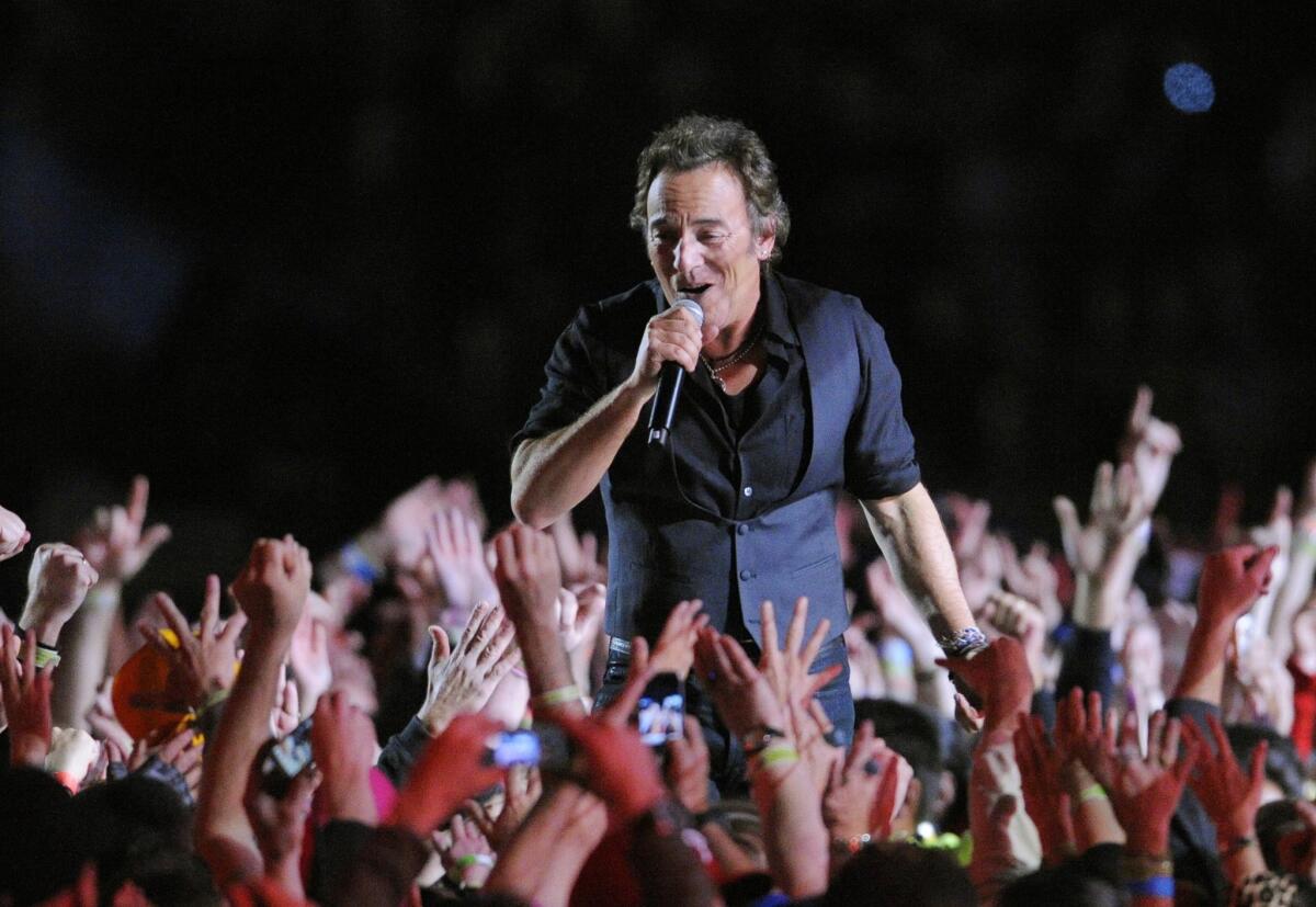 Bruce Springsteen performs at the 2009 Super Bowl. He's written a memoir.