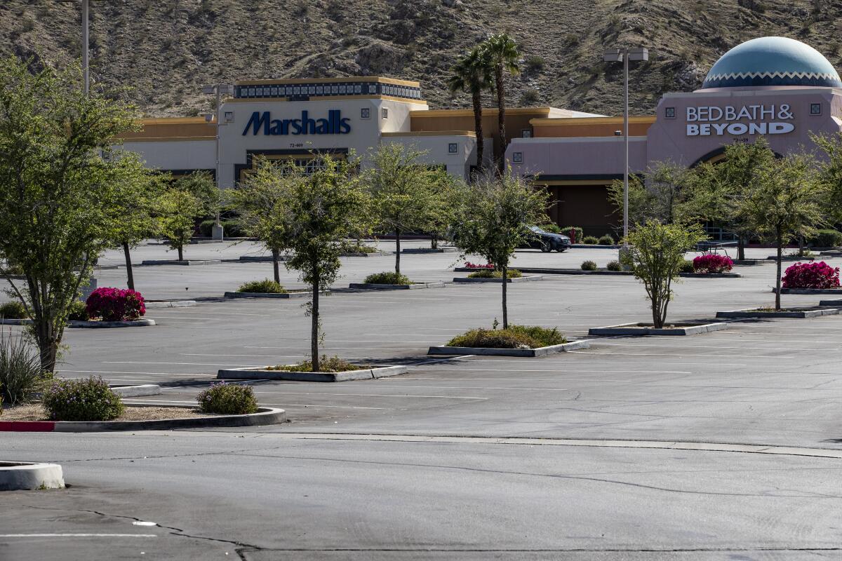 Parking lots are empty as stores are closed during the coronavirus pandemic in Rancho Mirage.