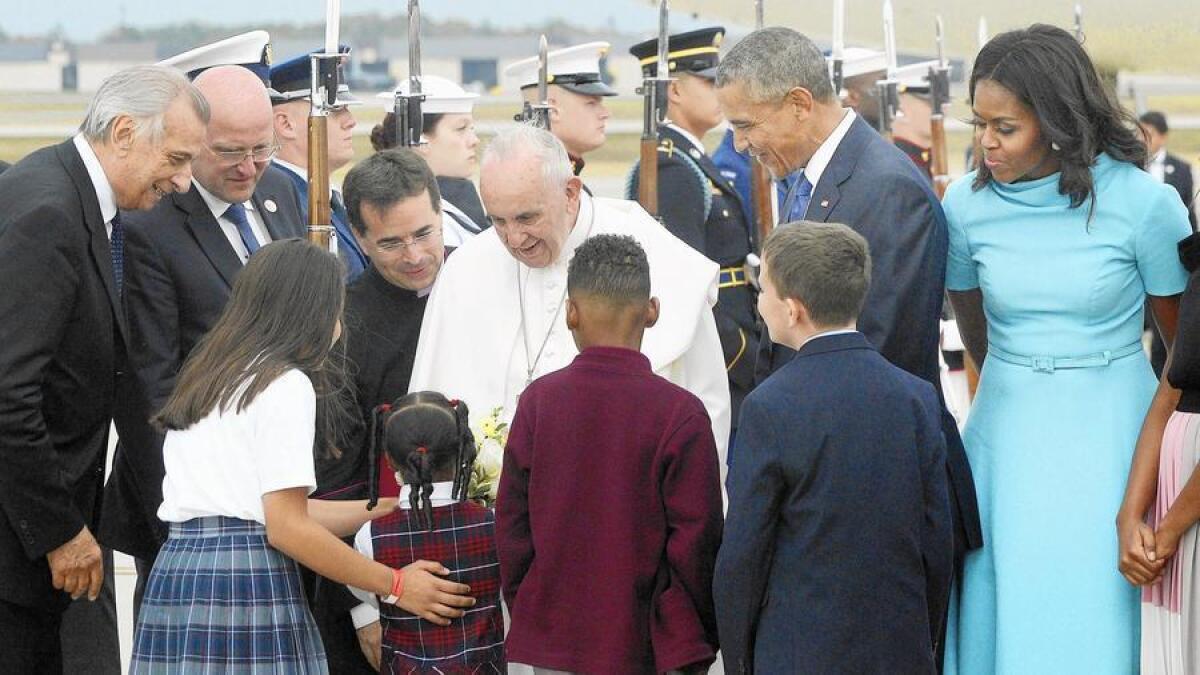 President Barack Obama and First Lady Michelle Obama welcome Pope Francis.