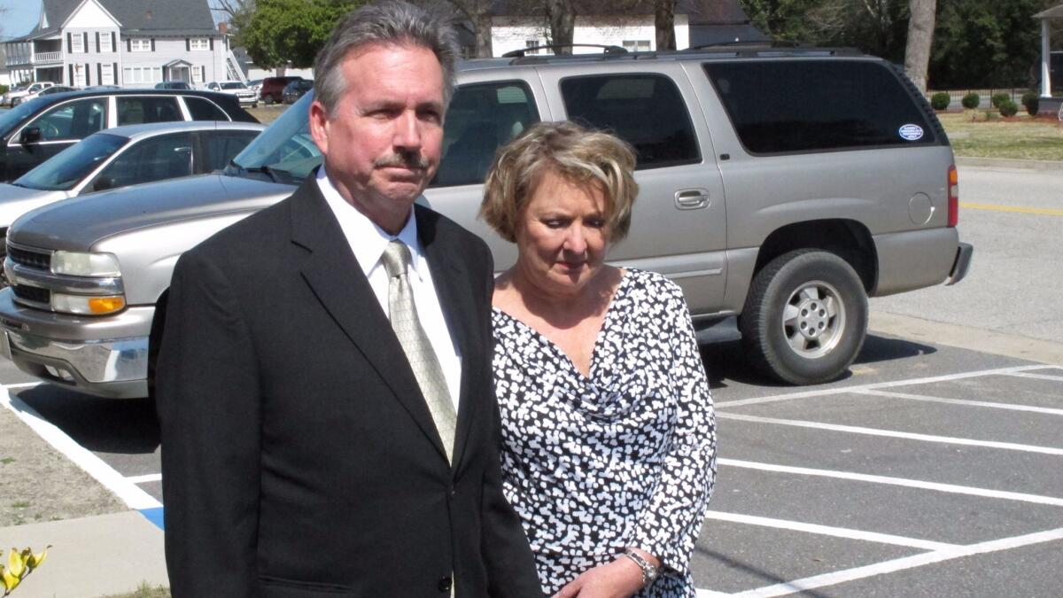 Richard and Elizabeth Jones, whose daughter, Sarah, was killed by a train on a Georgia movie set in 2014, met with reporters outside the Wayne County Courthouse in Jesup, Ga., the following year. (Russ Bynum / Associated Press)