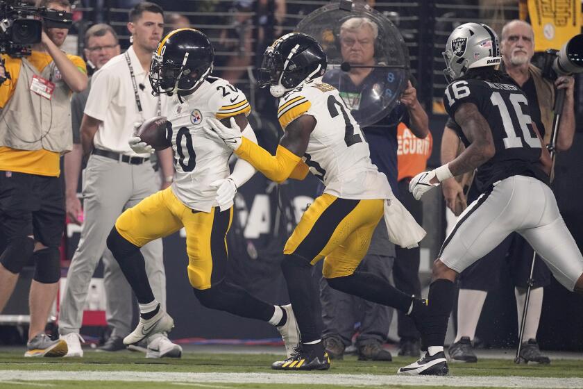 Pittsburgh Steelers cornerback Patrick Peterson (20) runs back with an intercepted pass during the second half of an NFL football game against the Las Vegas Raiders Sunday, Sept. 24, 2023, in Las Vegas. (AP Photo/Mark J. Terrill)