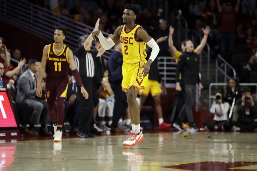 Southern California guard Jonah Mathews (2) runs back after making a 3-point basket during the second half of an NCAA college basketball game against Arizona State Saturday, Feb. 29, 2020, in Los Angeles. (AP Photo/Marcio Jose Sanchez)