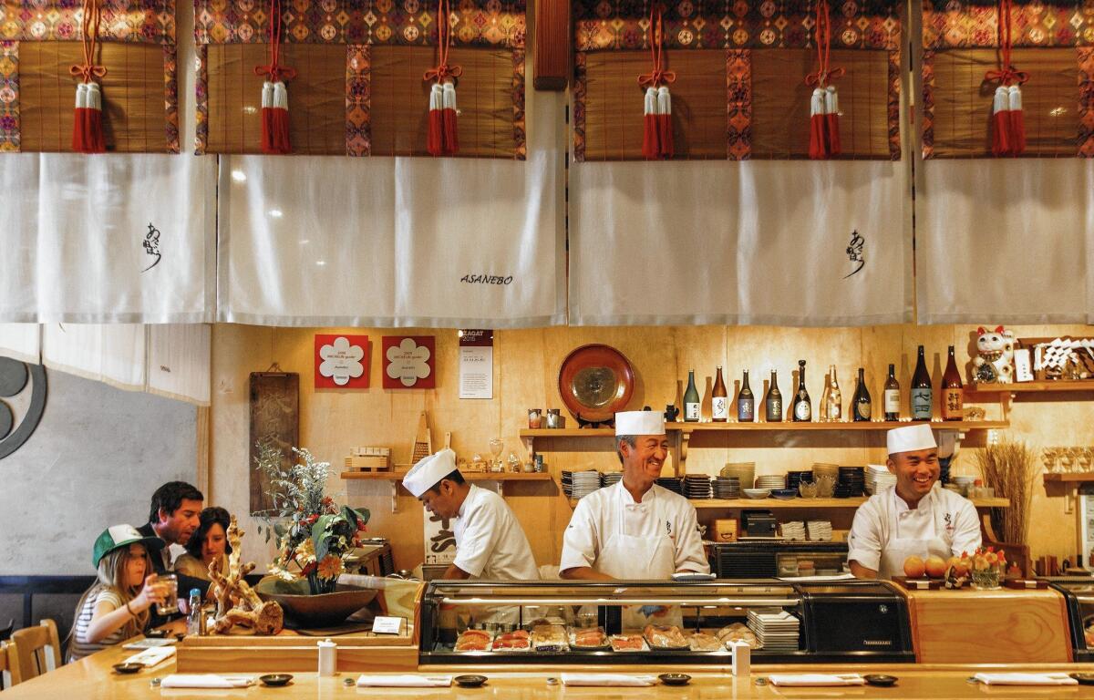 Chef Tetsuya Nakao, center, with his team behind the counter at Asanebo in Studio City.