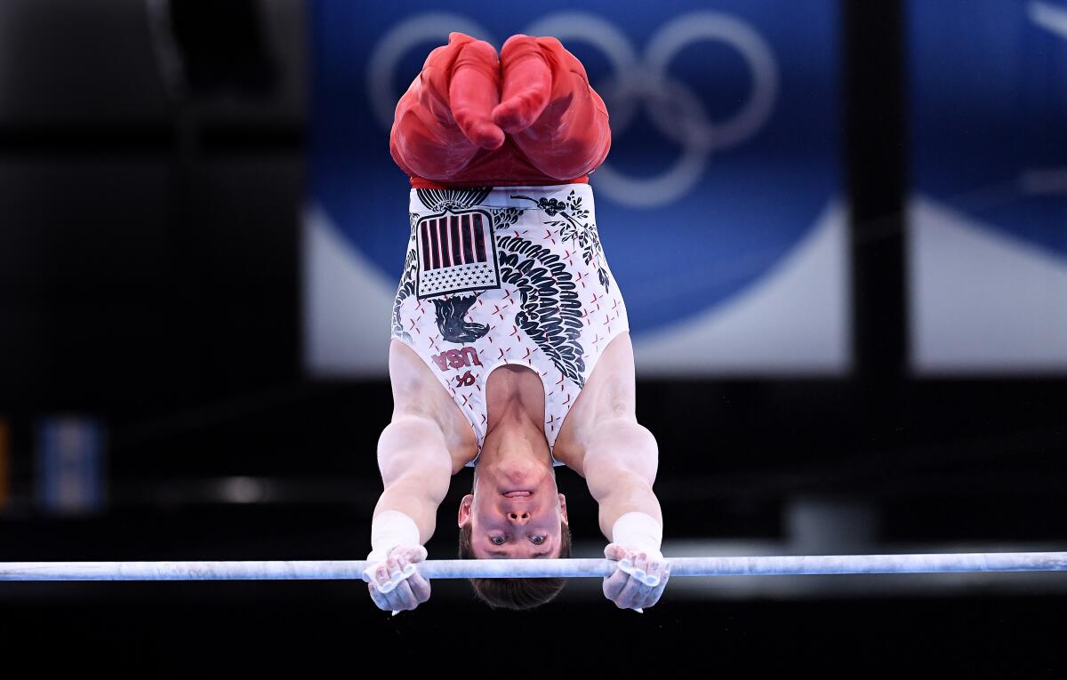 American Brody Malone competes on the high bar during team qualifying at the Tokyo Olympics.