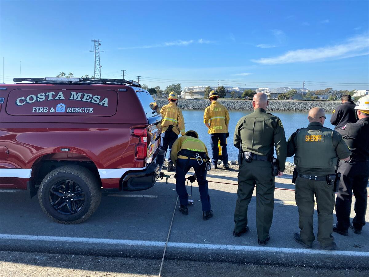 First responders at a portion of the Santa Ana river in Huntington Beach, where a body was found Jan. 4., 2022.