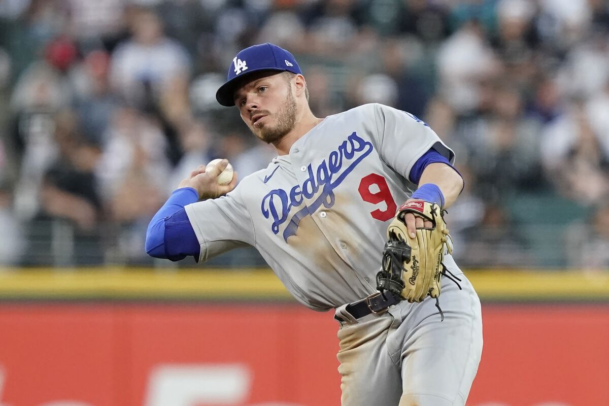 Dodgers infielder Gavin Lux throws to first against the Chicago White Sox on June 7.