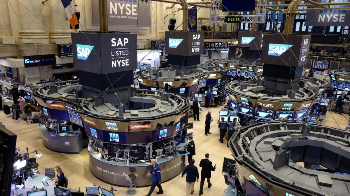 Traders work the floor at the New York Stock Exchange.