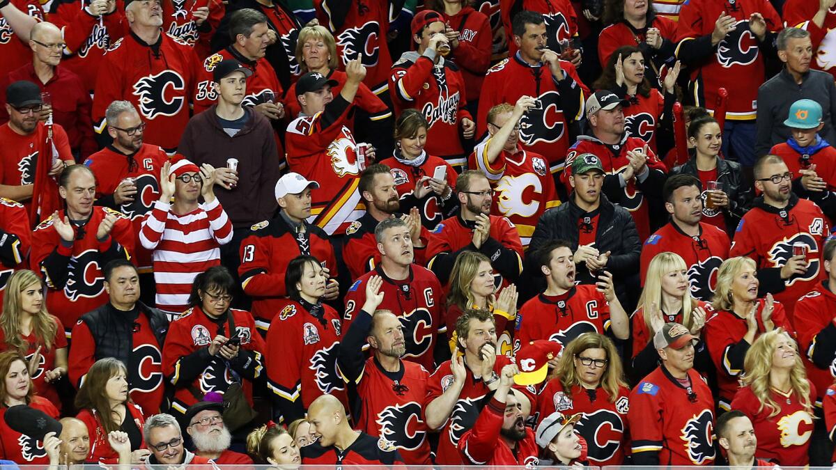 Calgary Flames fans cheer on their team during Game 6 of the Western Conference quarterfinals against the Vancouver Canucks on April 25.