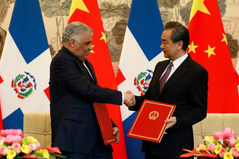 Mandatory Credit: Photo by HOW HWEE YOUNG/EPA-EFE/REX/Shutterstock (9646865e) Miguel Vargas and Wang Yi Domincan Republic and China formally establish diplomatic relations, Beijing - 01 May 2018 Dominican Republic Foreign Minister Miguel Vargas (L) and China's Foreign Minister Wang Yi shake hands after a signing ceremony where they formally established diplomatic relations between the two countries at Diaoyutai State Guest-house in Beijing, China, 01 May 2018. The Dominican Republic announced 01 May 2018 that they are establishing formal diplomatic relations with China and breaking diplomatic ties with Taiwan. ** Usable by LA, CT and MoD ONLY **