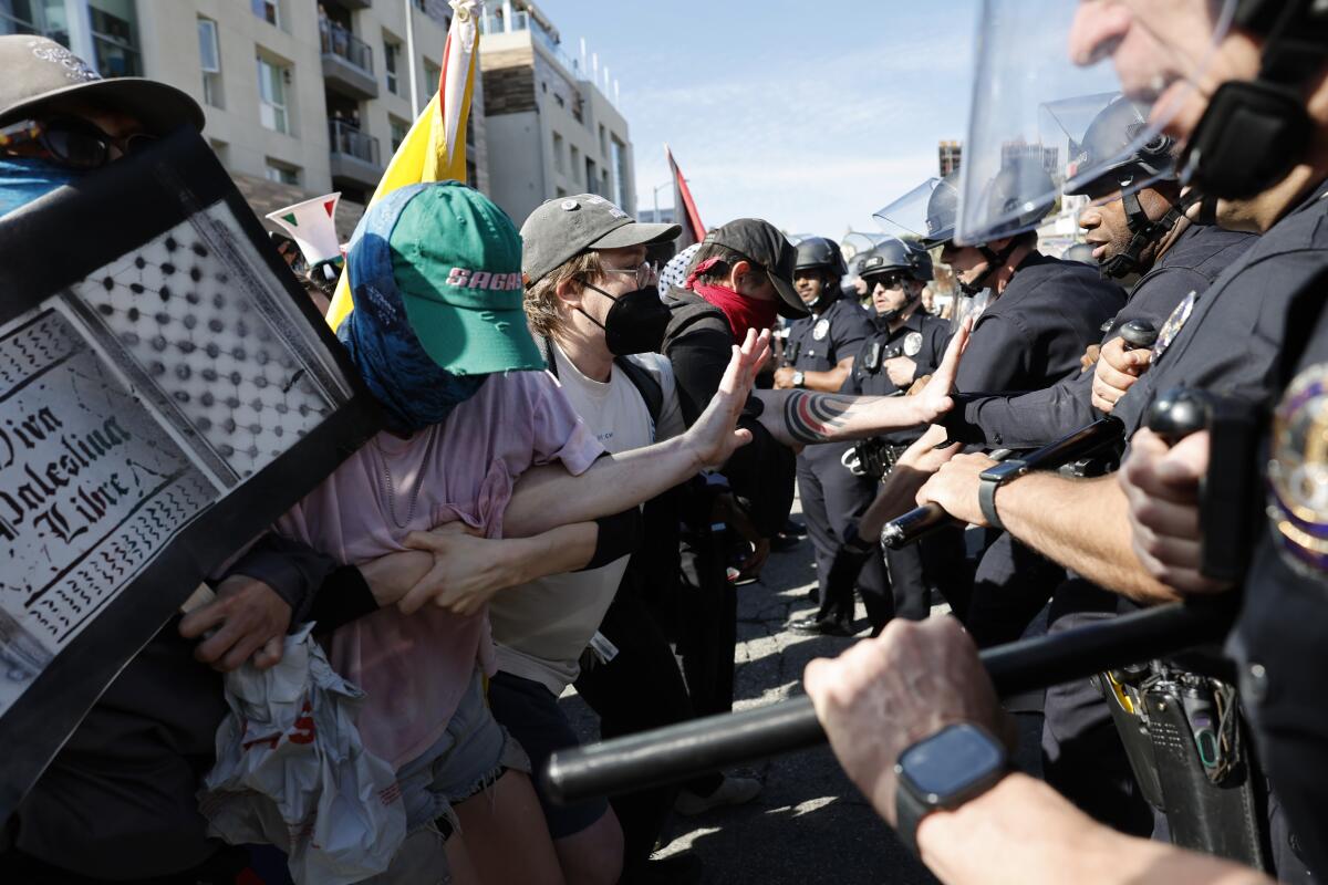Police clash with protesters in Hollywood.