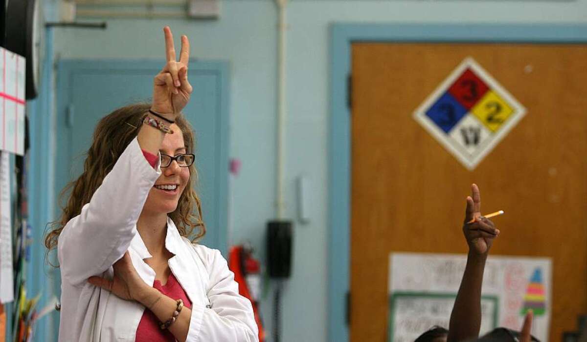 A science teacher gestures in her classroom at Markham Middle School, which has been the longtime subject of a turnaround effort but had about half its teachers laid off in 2010.