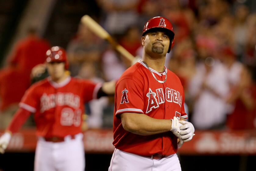 Albert Pujols reacts after flying out and stranding the tying run in the ninth inning against the Athletics on Sept. 30.