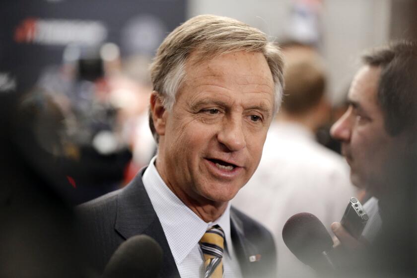 Tennessee Gov. Bill Haslam talks with reporters in Nashville on April 13.