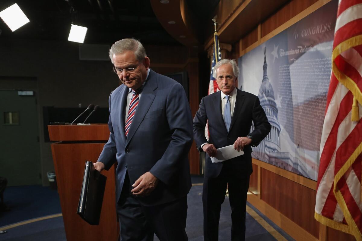 Senate Foreign Relations Committee Chairman Robert Menendez (D-N.J.), left, and ranking member Sen. Bob Corker (R-Tenn.) leave after a news conference at the Capitol on Friday.