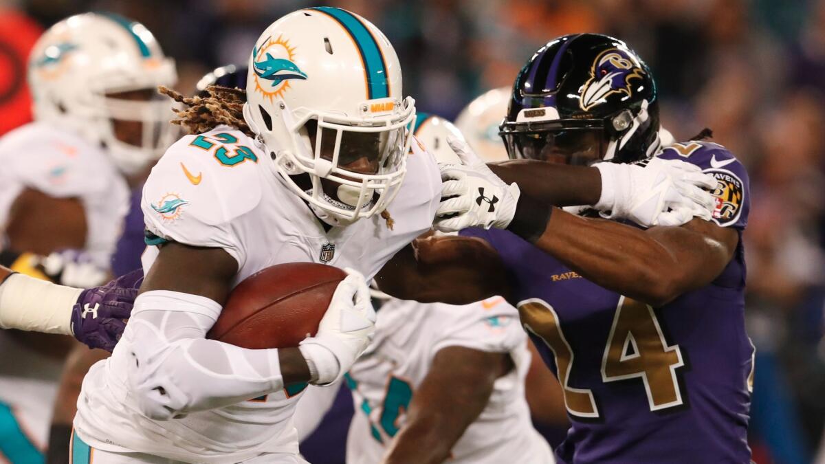 Miami running back Jay Ajayi carries the ball against the Baltimore Ravens on Oct. 26.