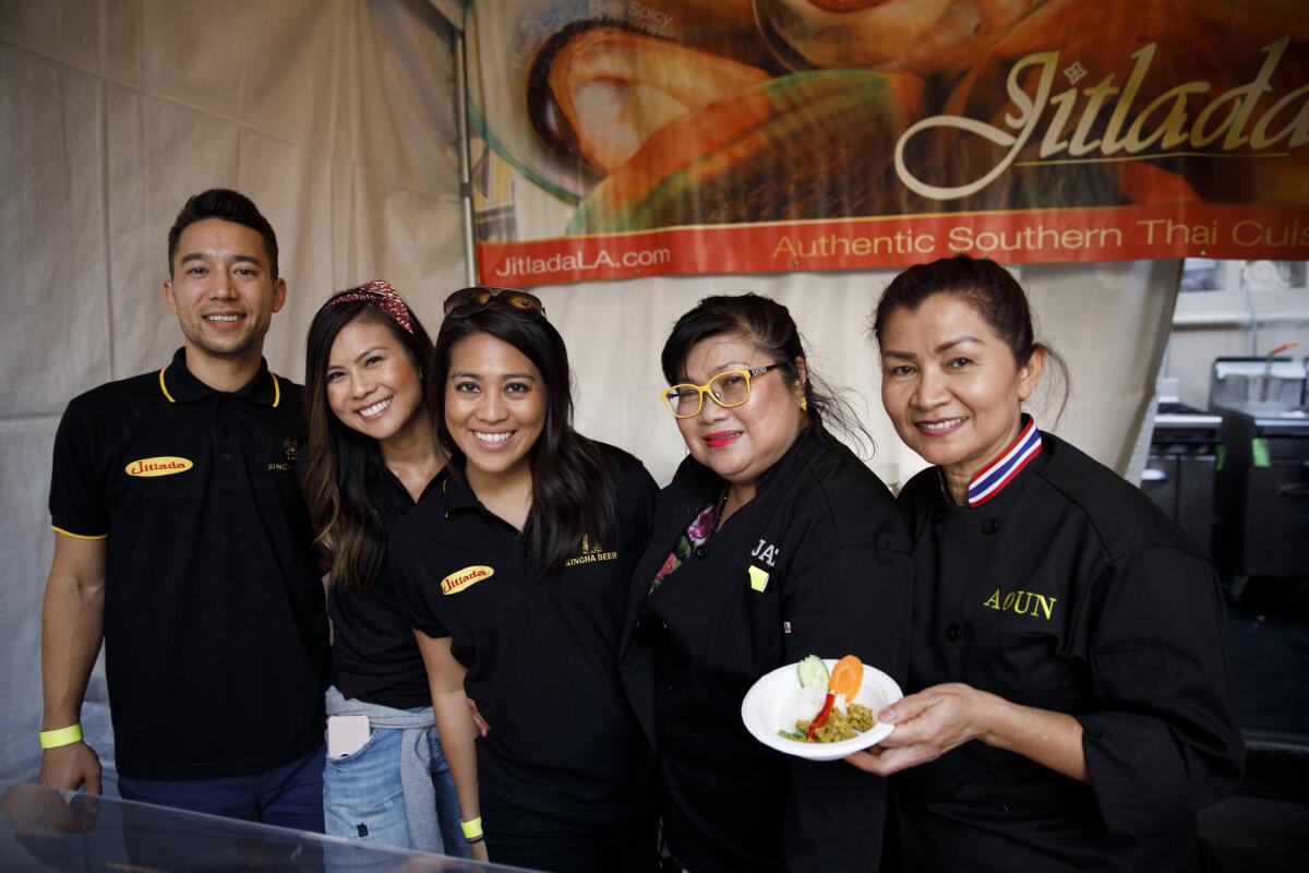 From left, Charles Kuhnau, Jenny Kuhnau, Sirine Bunkua, Jazz Singsanong and Aoun Sungkamee stand with spicy Kua Kling dry Thai curry with ground chicken from Jitlada during The Taste on the Paramount Studios backlot on Sept. 2.