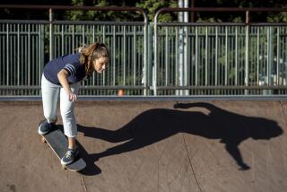 SOUTH PASADENA, CA - November 14 2021: Aunt Skatie crew leader Maggie Bowen drops in on a halfpipe.