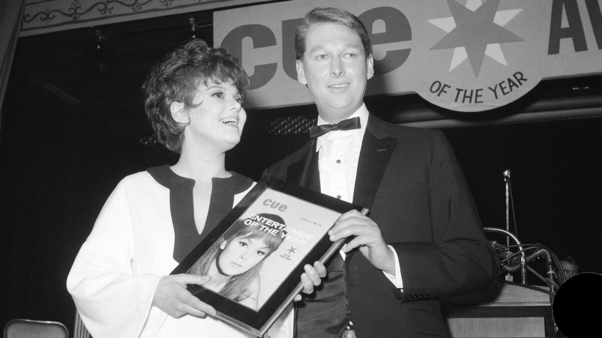 Barbara Harris, left, receiving Cue Magazine's "Entertainer of the Year" award from director Mike Nichols in New York on Jan. 4, 1967.