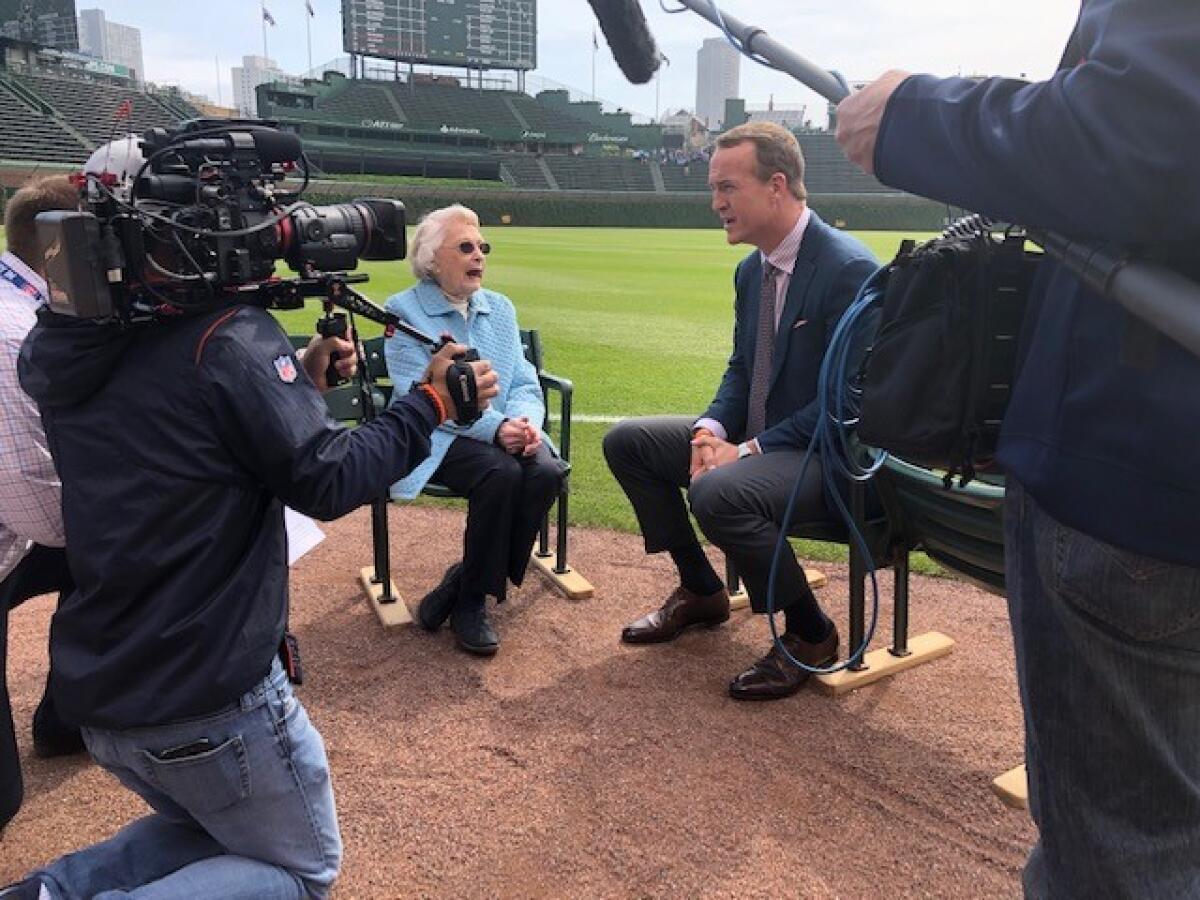 Peyton Manning interviews Chicago Bears owner Virginia Halas McCaskey at Wrigley Field, where the Bears played from 1921-70.