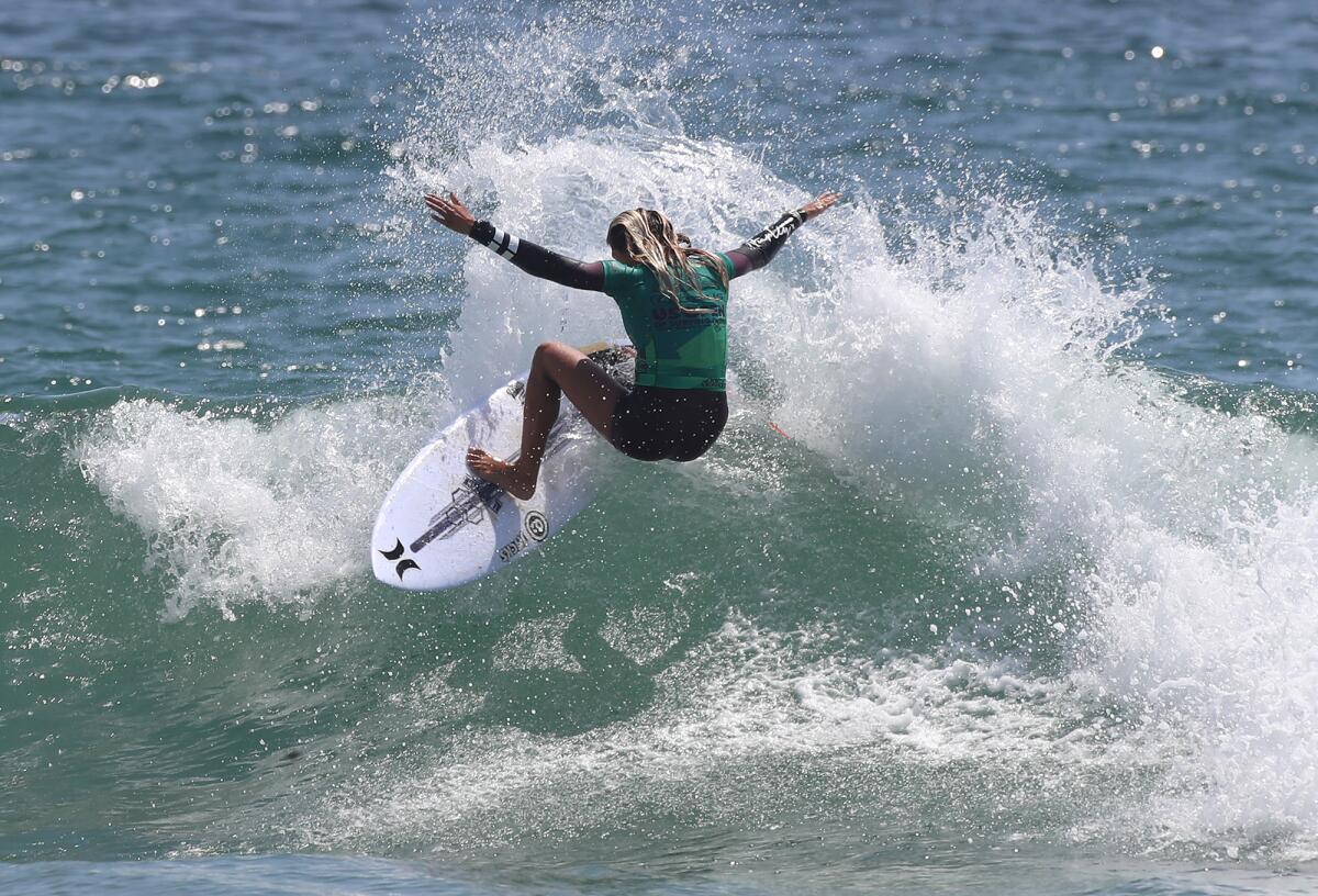 Sara Freyre of Huntington Beach cuts back on a wave during the U.S. Open of Surfing on Wednesday.