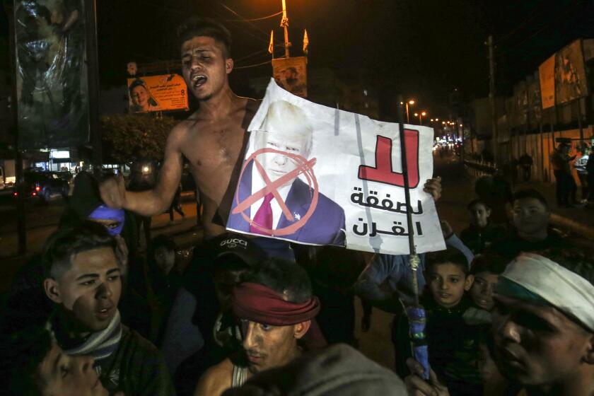 Palestinians in the southern Gaza Strip protest against a U.S. peace plan proposal on Thursday.
