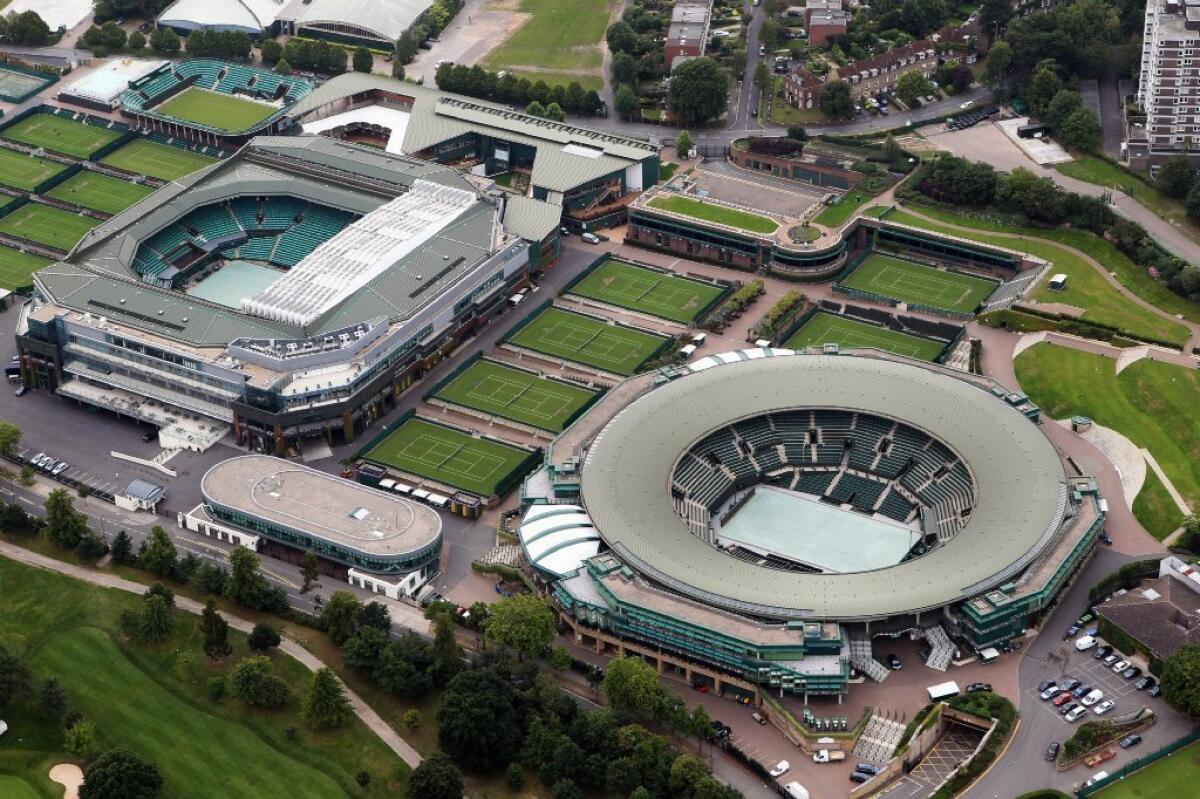Wimbledon plans to install a retractable roof over Court 1, right. Centre Court, left, already has a retractable roof.