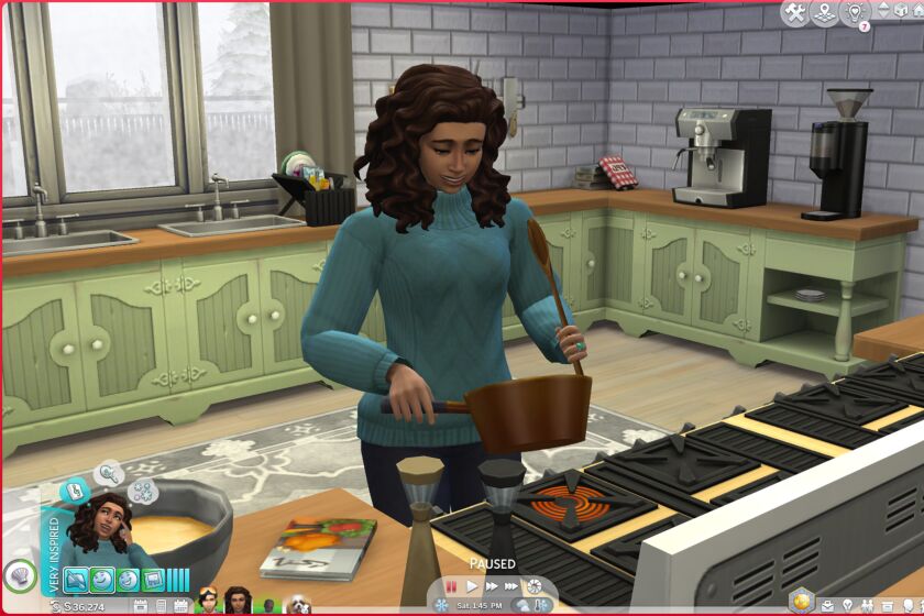 Lauren J. Mapp’s Simself — Lolo Simile — cooks mac and cheese in the kitchen for lunch.