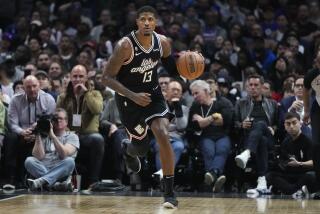 Los Angeles Clippers' Paul George dribbles during second half of an NBA basketball game against the Toronto Raptors