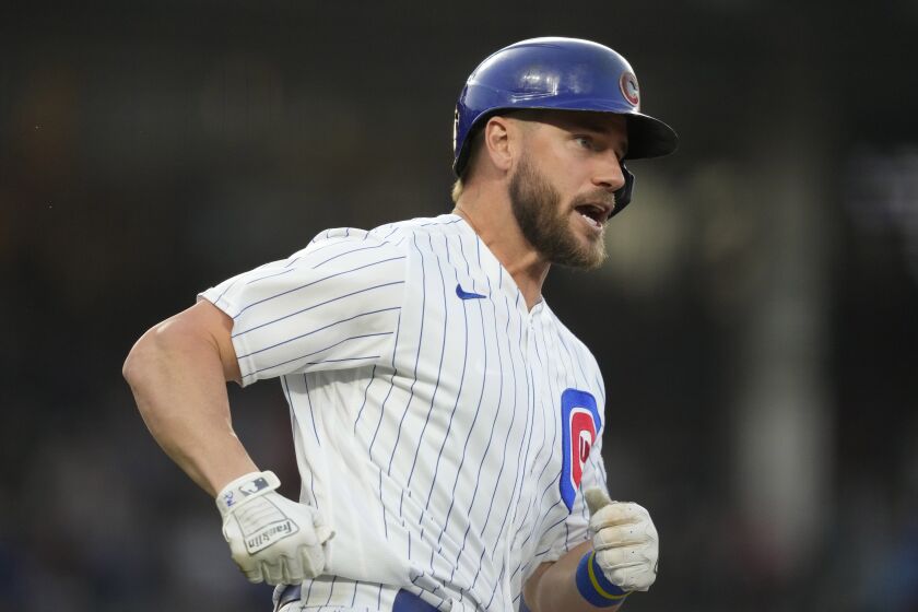 Chicago Cubs' Patrick Wisdom runs the bases on a two-run home run off St. Louis Cardinals starting pitcher Jordan Montgomery during the third inning of a baseball game Wednesday, May 10, 2023, in Chicago. (AP Photo/Charles Rex Arbogast)