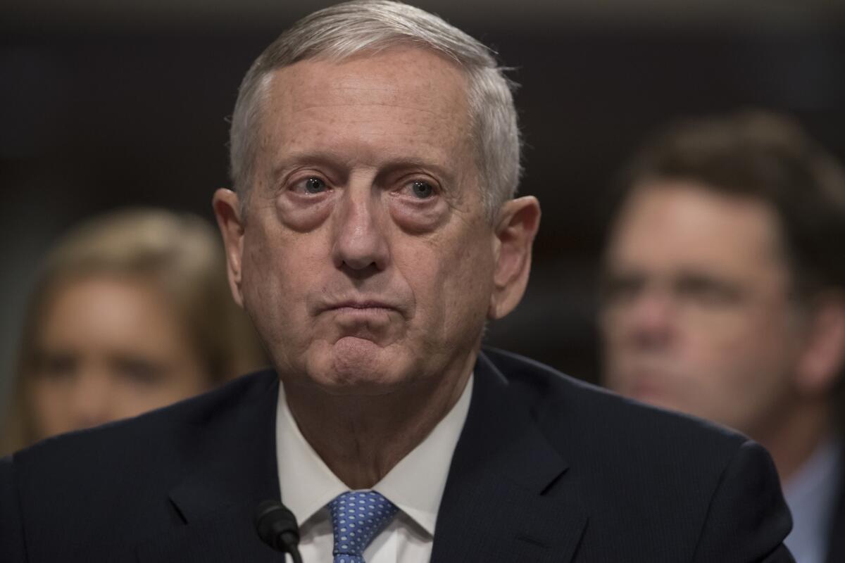 Defense Secretary-designate James Mattis listens while testifying at his confirmation hearing before the Senate Armed Services Committee.