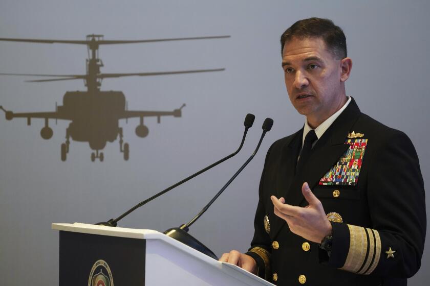 FILE - U.S. Navy Vice Adm. Brad Cooper, who heads the Navy's Bahrain-based 5th Fleet, speaks at an event at the International Defense Exhibition and Conference in Abu Dhabi, United Arab Emirates, Feb. 21, 2023. The top commander of U.S. naval forces in the Middle East says Yemen’s Houthi rebels are showing no signs of ending their “reckless” attacks on commercial ships in the Red Sea. But Vice Adm. Brad Cooper said in an Associated Press interview on Saturday that more nations are joining the international maritime mission to protect vessels in the vital waterway and trade traffic is beginning to pick up. (AP Photo/Jon Gambrell, File)