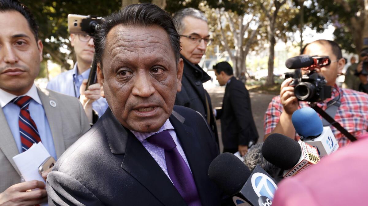 L.A. City Councilman Gil Cedillo at a news conference Thursday discusses a proposal targeting businesses that have city contracts and are seeking to work on President Trump's proposed wall.