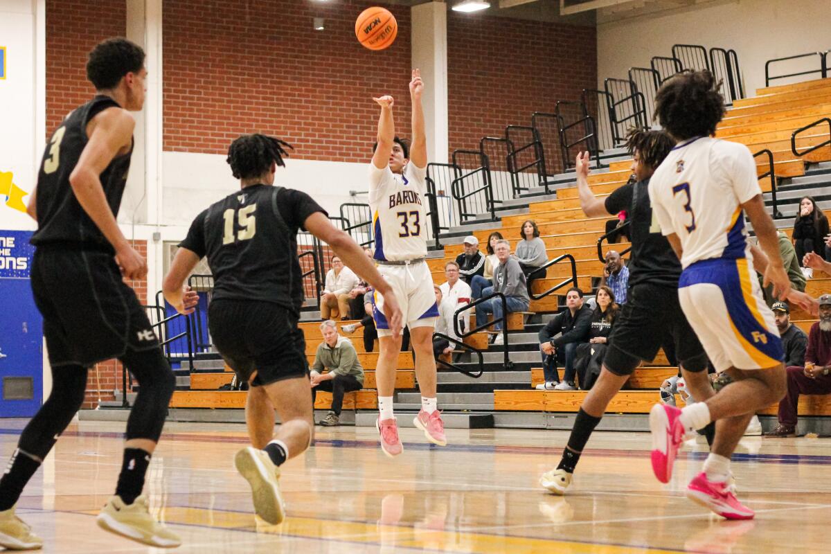 Fountain Valley junior Troy Leach launches a shot during Tuesday night's game.