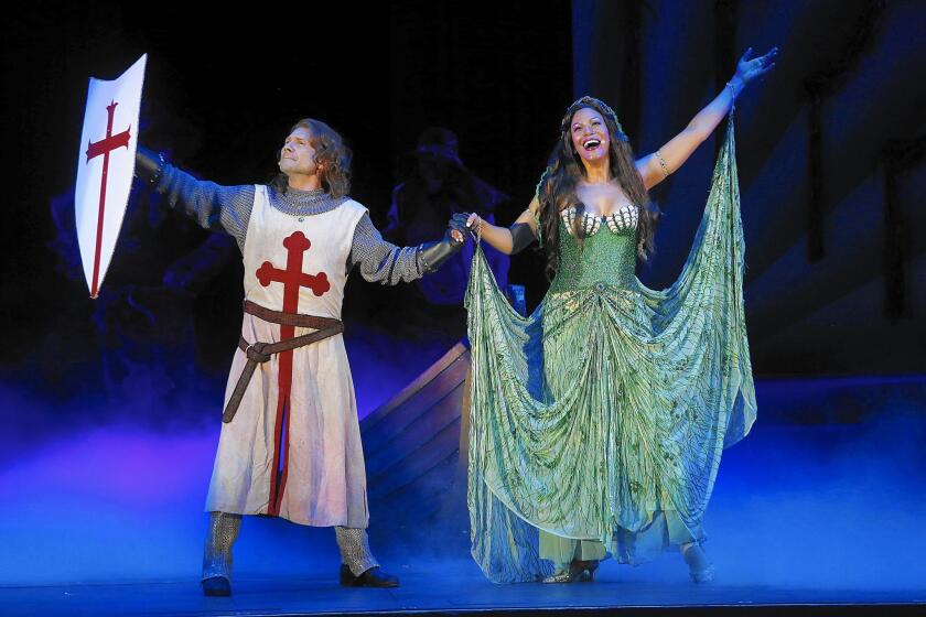 Christian Slater as Sir Galahad and Merlle Dandridge as the Lady of The Lake perform in "Spamalot" at the Hollywood Bowl on July 31, 2015.