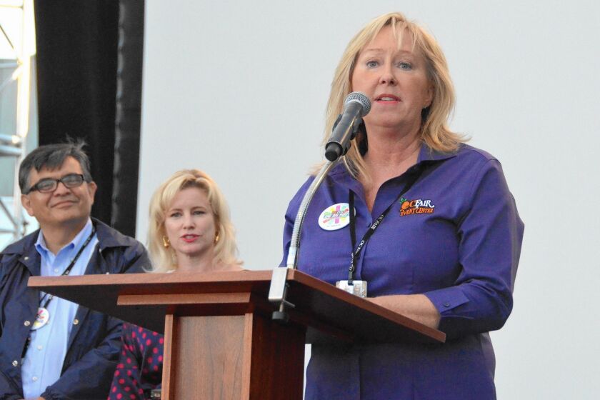 Kathy Kramer, Orange County Fairgrounds CEO, welcomes audience members Thursday to the grand opening ceremony for Plaza Pacifica.