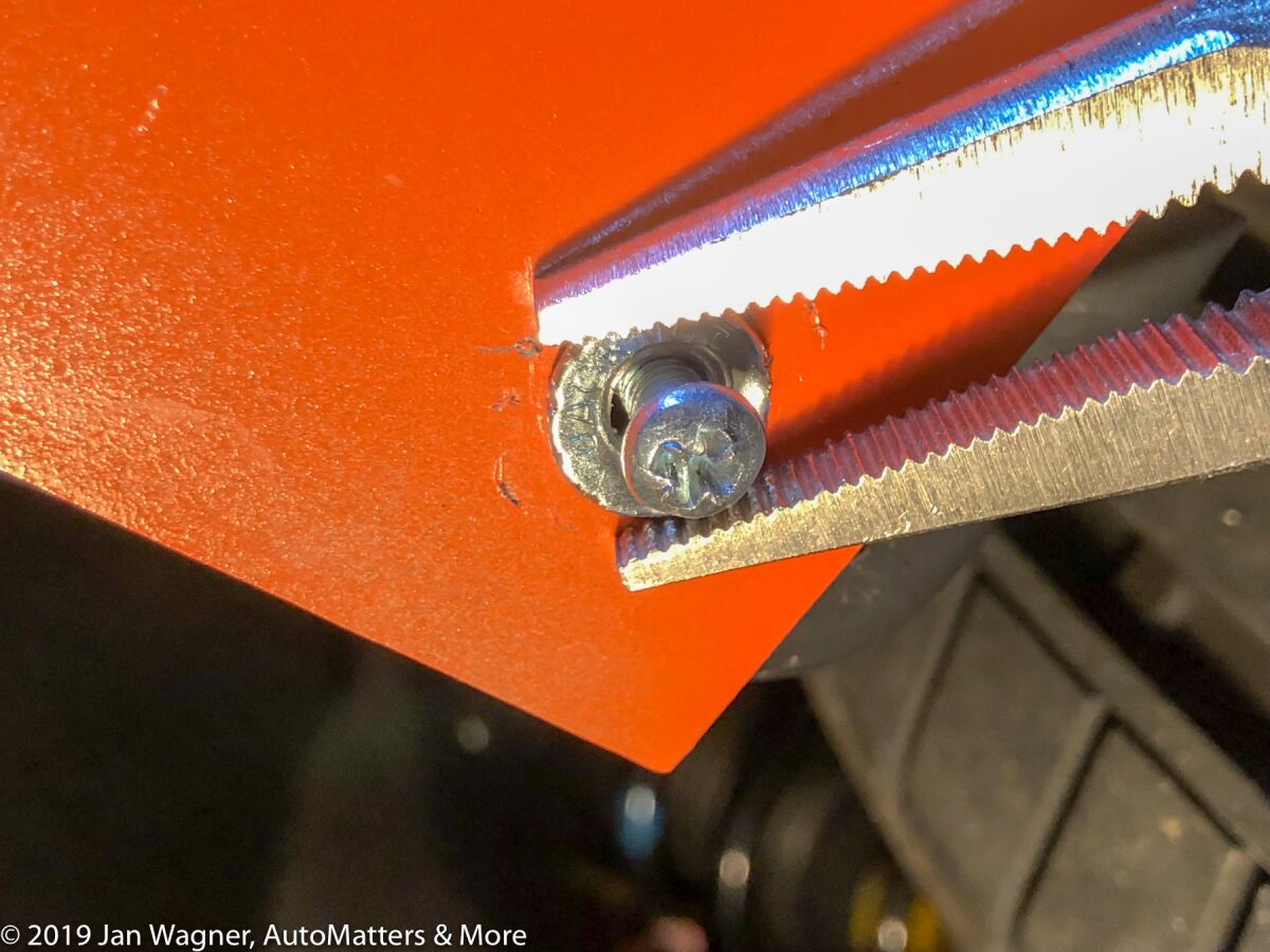Holding the jack nut with Vise Grips to secure it by turning the screw